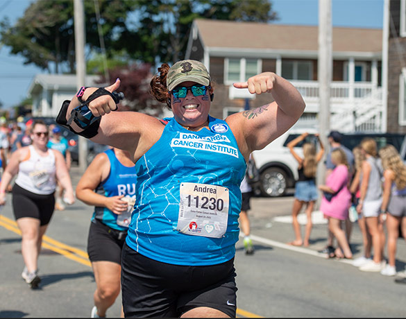 A Falmouth Road Race runner smiles for a photo