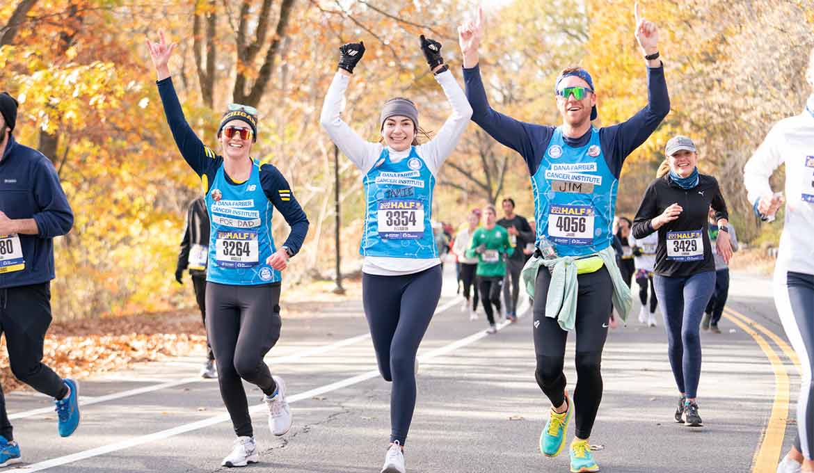 Three people running a race to support Dana-Farber Cancer Institute and The Jimmy Fund