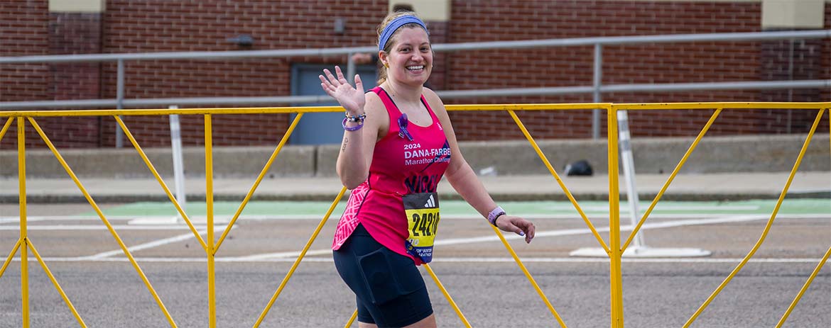 A Dana-Farber Marathon Challenge runner waves for a photo