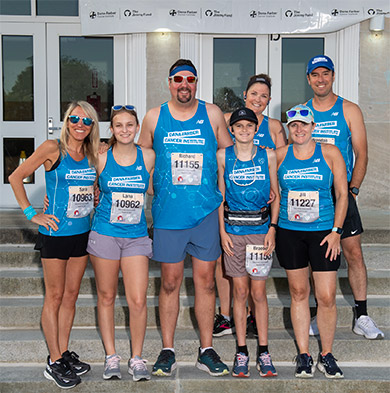 A group photo of Run for Dana-Farber participants before a race