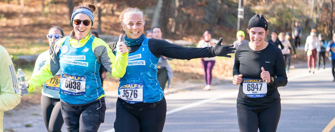 Two Run for Dana-Farber runners participating in a race