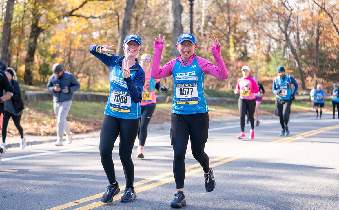 Two Run for Dana-Farber runners participating in a race