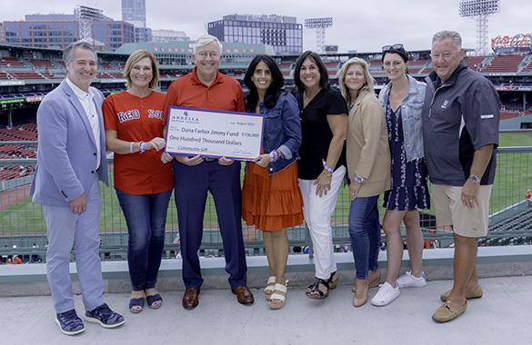 Presenting sponsor Arbella Insurance smiles with a check for Dana-Farber and the Jimmy Fund totaling $100,000