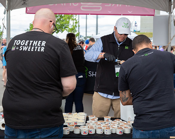 Volunteers scoop more than 50 ice cream flavors at Scooper Bowl