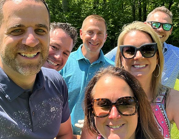 A selfie-style photo with six people