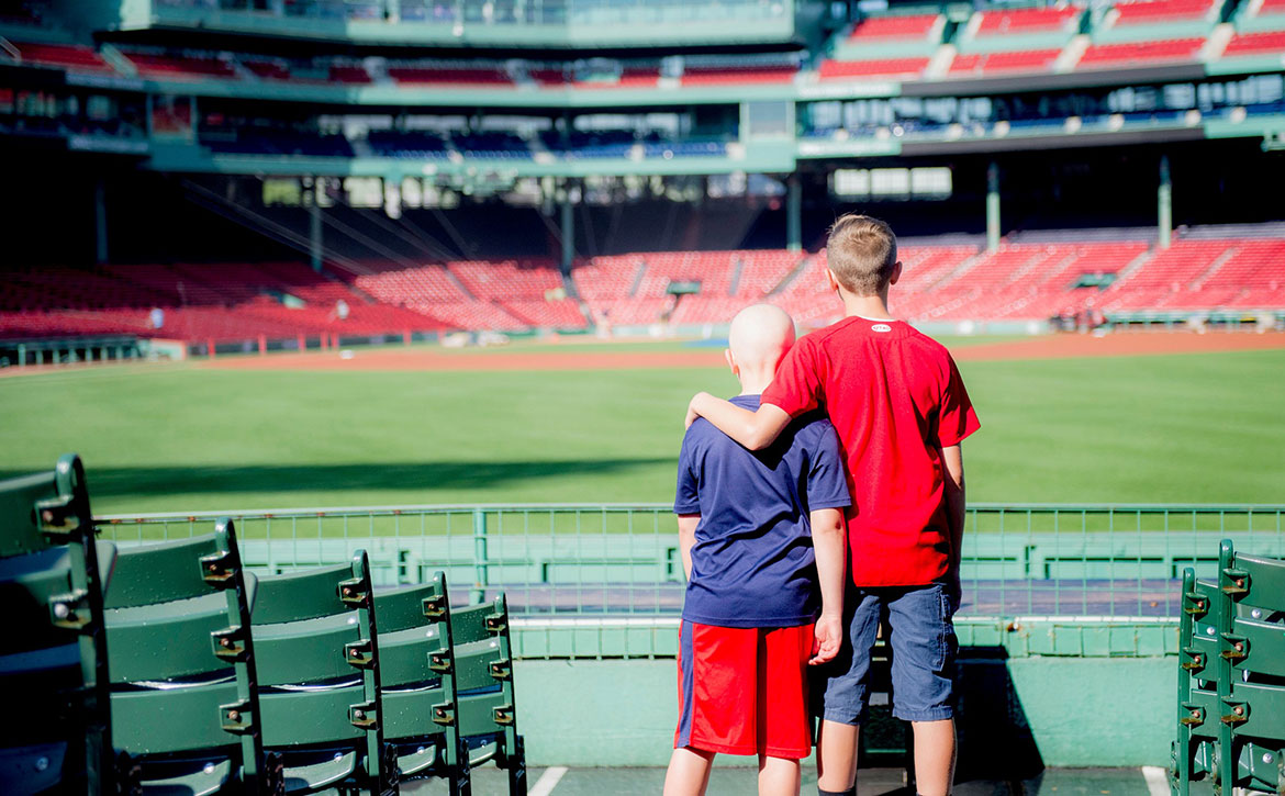 Two boys at empty Fenway Park
