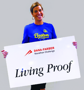 Anne, a Dana-Farber patient holding Living Proof sign