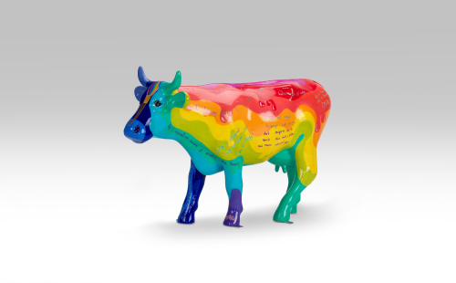 Colorful mini cow facing left