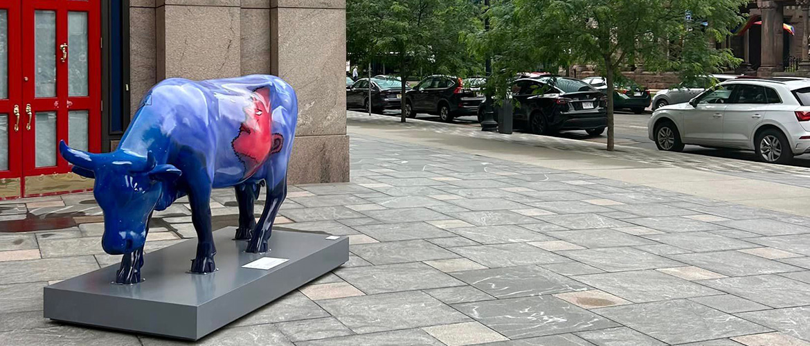 Grazing cow sculpture on a street in Boston