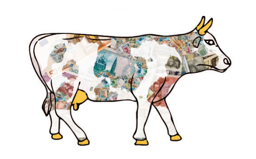 Cow covered in various currency facing right