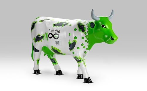 Green and white cow with shoes facing right