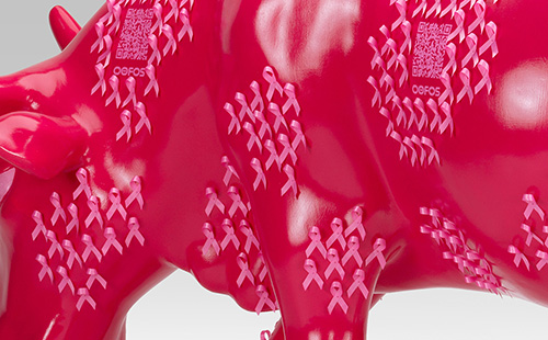 Pink cow with breast cancer ribbons close-up