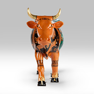 Orange cow sculpture facing forward