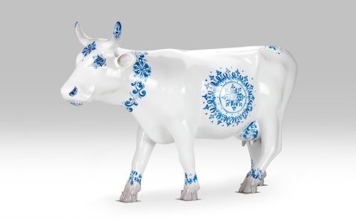 Delft Blue pottery cow facing left