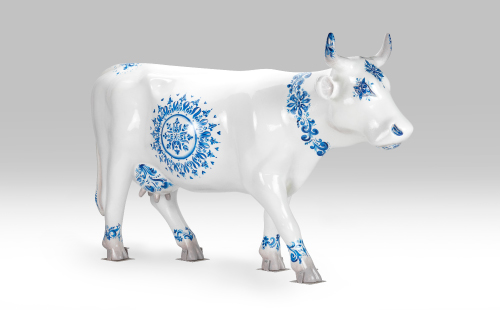 Delft Blue pottery cow facing right