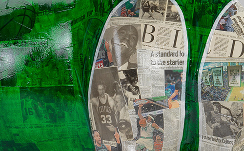 Celtics inspired cow covered in newspaper close-up