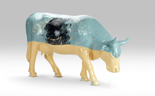 Cow with a dog painted on it facing right