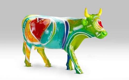 Green cow with heart design facing right