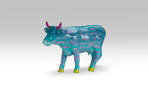 Teal mini cow covered in pink words facing left