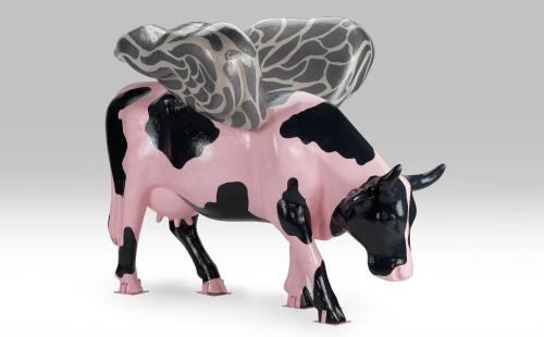 Cow painted like a pig with wings facing right