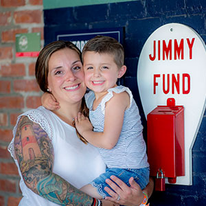 A mother and her daughter, a Jimmy Fund Clinic patient, at Fenway Park