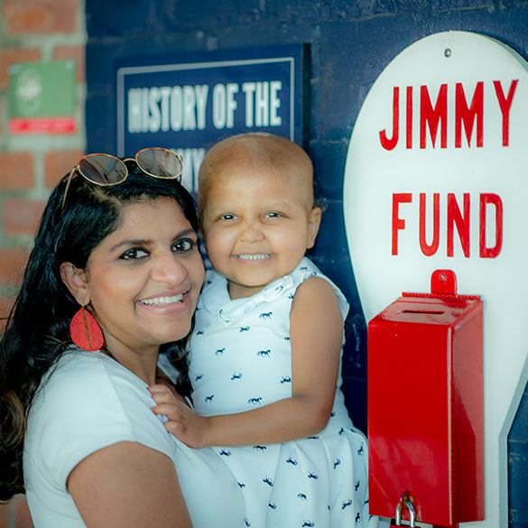 A Jimmy Fund clinic patient with her mother at Fenway Park