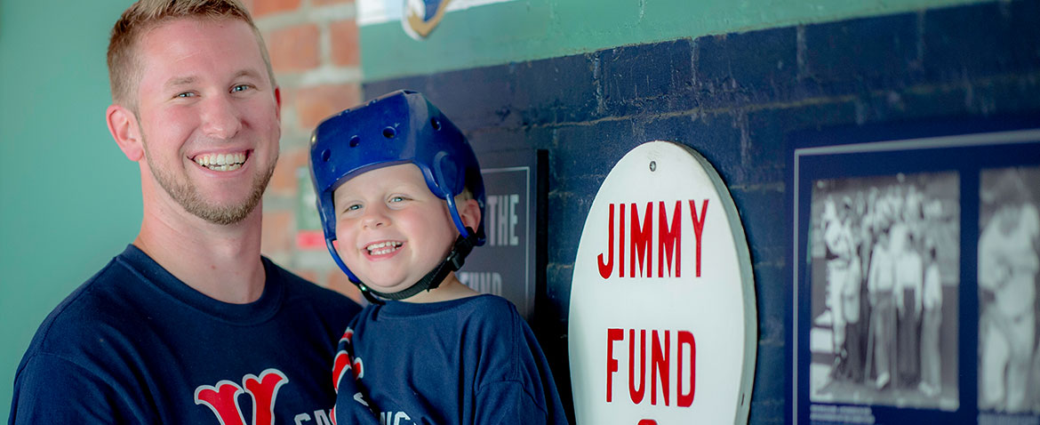 Dana-Farber Jimmy Fund Clinic patient, Conor, with his dad at Fenway Park