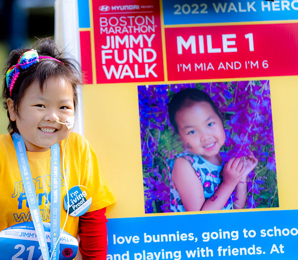 Jimmy Fund Walk Hero with her Hero Poster on the course