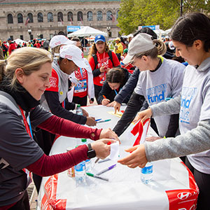 Volunteers working at a table at the Finish Line