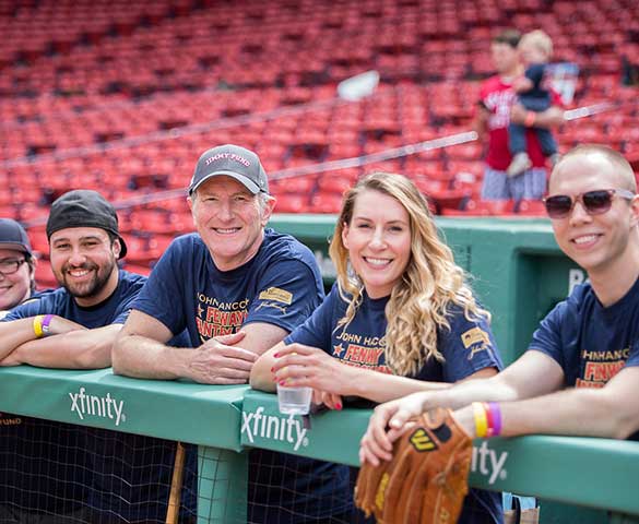 Fantasy Day participants in a dugout at Fenway Park